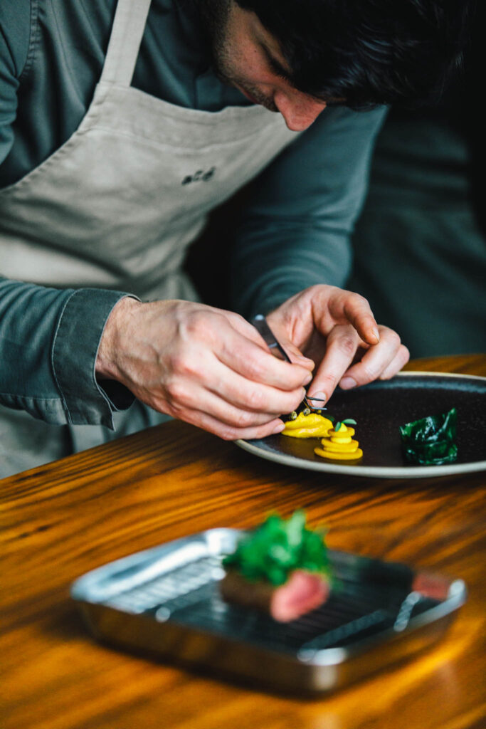 Chef Filip Hanlo at his chef's table restaurant até at luxury boutique hotel The Dylan Amsterdam, part of The Leading Hotels of the World and awarded by Gault & Millau.